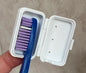 Zahnbürstenkopfbehälter mit Tropfer